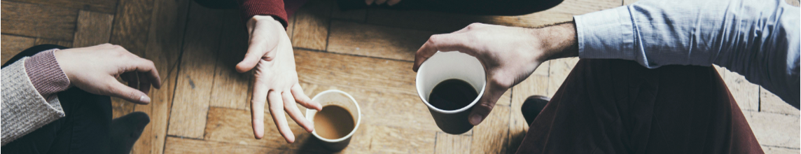 Image of hands and coffee cups